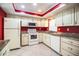 Kitchen featuring tile floors, granite countertops, and modern appliances at 635 Cottage Ln # 635, Lakeland, FL 33803
