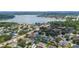 Gorgeous aerial view of a neighborhood near a lake, showcasing many residences and lush landscaping at 715 Hanover Ct, Lakeland, FL 33813