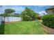Lush green backyard with mature trees, offering a serene and private outdoor space for relaxation at 715 Hanover Ct, Lakeland, FL 33813