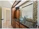 Bathroom with unique glass bowl sink, modern cabinets, and decorative backsplash at 715 Hanover Ct, Lakeland, FL 33813
