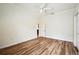 Bright bedroom with light wood flooring, white walls, fan, and closet at 715 Hanover Ct, Lakeland, FL 33813