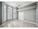 A bedroom with tile floor, light grey walls, crown molding, and 3 windows at 715 Hanover Ct, Lakeland, FL 33813