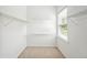 Walk-in closet with carpeted floors, wire shelving, and a window for natural light at 715 Hanover Ct, Lakeland, FL 33813