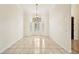 Dining room with tiled floor, a chandelier, natural light, and shuttered windows at 715 Hanover Ct, Lakeland, FL 33813
