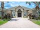 A beautiful house with a brick driveway and landscaping at 715 Hanover Ct, Lakeland, FL 33813