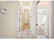 Hallway with tile flooring and neutral color palette at 715 Hanover Ct, Lakeland, FL 33813