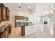 Open-concept kitchen with granite countertops, stainless steel appliances, and island seating at 715 Hanover Ct, Lakeland, FL 33813