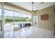 Screened lanai with tile flooring, a ceiling fan, and views of the pool and outdoor area at 715 Hanover Ct, Lakeland, FL 33813