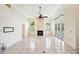 Bright living room with fireplace, plantation shutters, and access to outdoor pool area at 715 Hanover Ct, Lakeland, FL 33813
