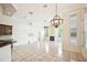 Open-concept living room with tile floors, fireplace, and arched windows allowing natural light at 715 Hanover Ct, Lakeland, FL 33813