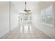 Bright living room with tile floors, bay windows, and modern ceiling fans at 715 Hanover Ct, Lakeland, FL 33813
