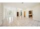 Spacious living room with tile floors and access to multiple rooms in the house at 715 Hanover Ct, Lakeland, FL 33813