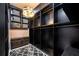 Elaborate walk-in closet with shelving, drawers, and crystal chandelier at 715 Hanover Ct, Lakeland, FL 33813