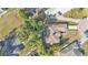An eye-level aerial view of the property, showing the house and surrounding greenery at 7230 Hileman W Dr, Lakeland, FL 33810