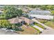 Overhead aerial view of the house with a well-maintained lawn and nearby garages at 7230 Hileman W Dr, Lakeland, FL 33810