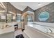 Modern bathroom with a separate shower and a deep soaking tub at 7230 Hileman W Dr, Lakeland, FL 33810