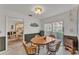Breakfast nook area featuring an octagonal wood table and view to backyard at 7230 Hileman W Dr, Lakeland, FL 33810