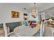 This dining room features modern chandelier and view into the kitchen at 7230 Hileman W Dr, Lakeland, FL 33810