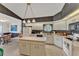 Spacious eat-in kitchen with island featuring white cabinets and view to the breakfast nook at 7230 Hileman W Dr, Lakeland, FL 33810