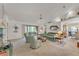 Open-concept living room with vaulted ceilings, large windows, and a comfortable seating area at 7230 Hileman W Dr, Lakeland, FL 33810