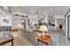 Bright living room featuring neutral walls, carpet, ceiling fan, and glass sliding doors to lanai at 7230 Hileman W Dr, Lakeland, FL 33810