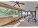 Enclosed patio with great natural light, ceiling fans, and outdoor furniture at 7230 Hileman W Dr, Lakeland, FL 33810