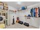 Organized walk-in closet with shelving for clothes, accessories and storage at 7230 Hileman W Dr, Lakeland, FL 33810