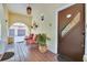 Inviting front porch with red tile flooring and cozy seating area at 845 E Edgewood Dr, Lakeland, FL 33803