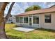 Back porch and patio with full-pane windows offer a great view of the surrounding area at 1010 Penguin Pl, Lakeland, FL 33809