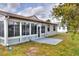 Back porch and patio with full-pane windows offer a great view of the surrounding area at 1010 Penguin Pl, Lakeland, FL 33809
