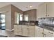 Well-equipped kitchen with stainless steel sink and views to the sunroom and living area at 1010 Penguin Pl, Lakeland, FL 33809