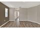 Inviting living room with wood-look flooring and neutral paint colors at 1010 Penguin Pl, Lakeland, FL 33809