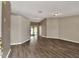 Large living room with vinyl floors offering access to the dining room, sunroom, and other areas of the house at 1010 Penguin Pl, Lakeland, FL 33809