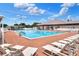Large pool with spacious deck area, lounge chairs, and covered seating at 1010 Penguin Pl, Lakeland, FL 33809