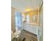 Bathroom features tile flooring, vanity, and walk-in shower at 1011 Pine Ridge Dr, Lakeland, FL 33809