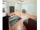 Bedroom with soft green walls, vinyl wood floors, ceiling fan, and neutral decor and decor at 1011 Pine Ridge Dr, Lakeland, FL 33809