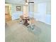 Comfortable dining space with a glass table, cozy chairs, and access to the rest of the home at 1011 Pine Ridge Dr, Lakeland, FL 33809
