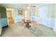 Inviting dining room featuring a glass table, four chairs, and easy access to other rooms at 1011 Pine Ridge Dr, Lakeland, FL 33809
