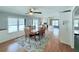 Open concept dining room offers natural light and ceiling fan at 1011 Pine Ridge Dr, Lakeland, FL 33809