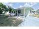 Inviting home featuring a covered entryway and attractive landscaping for enhanced curb appeal at 1011 Pine Ridge Dr, Lakeland, FL 33809