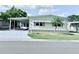 Charming single-story home with carport, well-maintained lawn, and cozy neighborhood feel at 1011 Pine Ridge Dr, Lakeland, FL 33809
