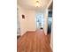 Hallway with vinyl plank flooring and access to the bathroom, bedrooms, kitchen and more at 1011 Pine Ridge Dr, Lakeland, FL 33809