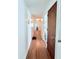 Hallway leads to bathroom, bedroom, and living areas at 1011 Pine Ridge Dr, Lakeland, FL 33809