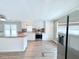 Bright kitchen features stainless appliances, island and ample white cabinetry at 1011 Pine Ridge Dr, Lakeland, FL 33809