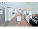Spacious kitchen with stainless appliances, island and ample white cabinetry at 1011 Pine Ridge Dr, Lakeland, FL 33809