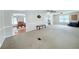 Open living space with carpet, seamlessly connected to dining and kitchen areas for easy flow at 1011 Pine Ridge Dr, Lakeland, FL 33809
