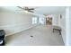 Bright and airy living area with carpet, providing access to other rooms for optimal living at 1011 Pine Ridge Dr, Lakeland, FL 33809