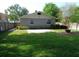 View of the backyard featuring a patio and mature landscaping at 1014 Lexington St, Lakeland, FL 33801