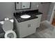 Bathroom showcasing a white vanity and black granite countertop at 1014 Lexington St, Lakeland, FL 33801