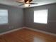 Bright bedroom with hardwood floors, natural light, and a ceiling fan at 1014 Lexington St, Lakeland, FL 33801